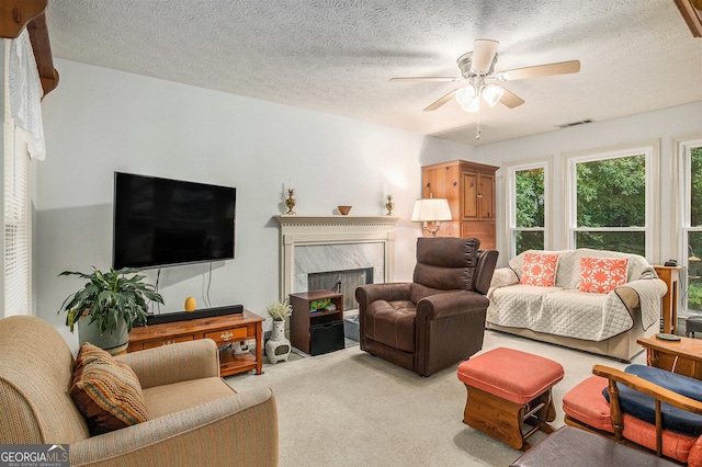 844 Potomac Pl, Winder, GA 30680 - living area with a ceiling fan, carpet floors, a premium fireplace, and a textured ceiling
