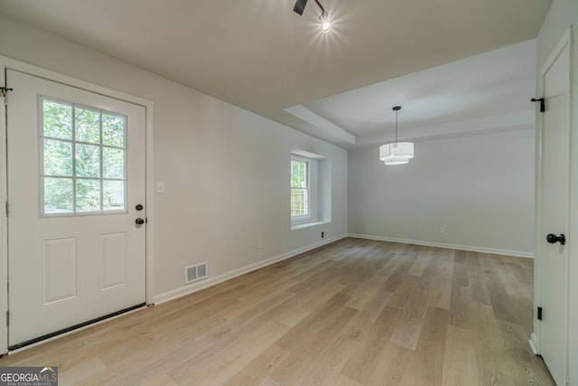 3404 Broxton Mill Way, Snellville, GA 30039 - unfurnished dining area featuring light wood-style floors and a tray ceiling