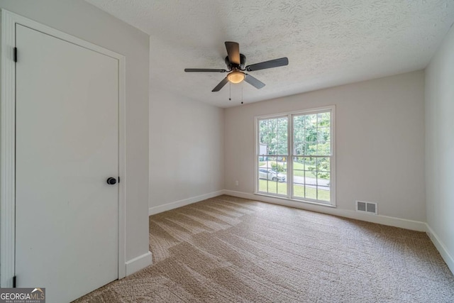 3404 Broxton Mill Way, Snellville, GA 30039 - spare room featuring carpet, ceiling fan, and a textured ceiling
