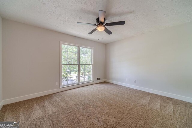 3404 Broxton Mill Way, Snellville, GA 30039 - empty room with a textured ceiling, carpet floors, and ceiling fan