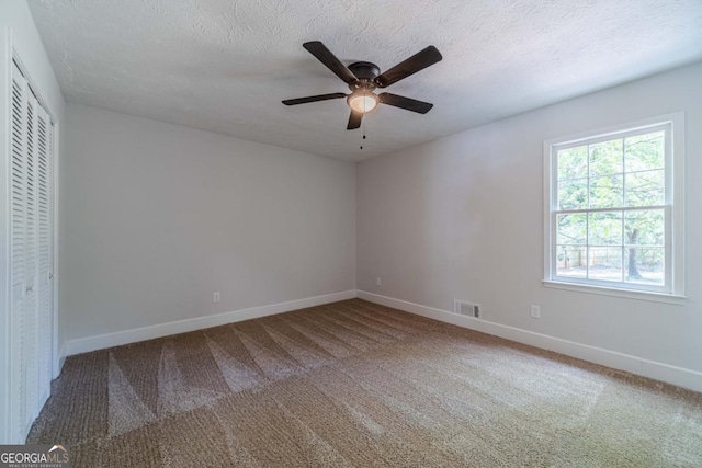 3404 Broxton Mill Way, Snellville, GA 30039 - unfurnished bedroom with carpet floors, a closet, ceiling fan, and a textured ceiling