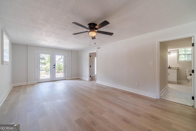 3404 Broxton Mill Way, Snellville, GA 30039 - spare room featuring a textured ceiling, light wood finished floors, a ceiling fan, and plenty of natural light