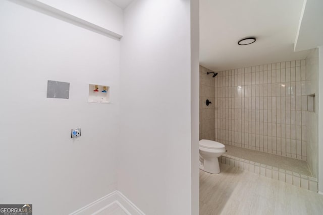 3404 Broxton Mill Way, Snellville, GA 30039 - full bathroom featuring a tile shower and wood finished floors