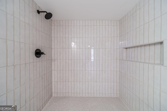 3404 Broxton Mill Way, Snellville, GA 30039 - bathroom featuring tiled shower and tile walls