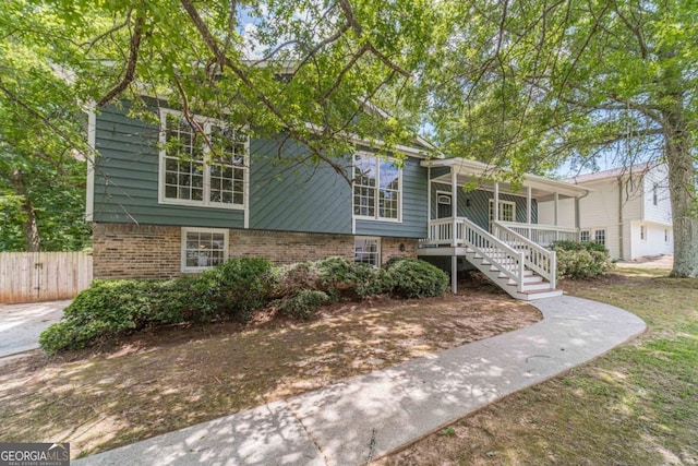 3404 Broxton Mill Way, Snellville, GA 30039 - view of front of property featuring brick siding, covered porch, and stairs