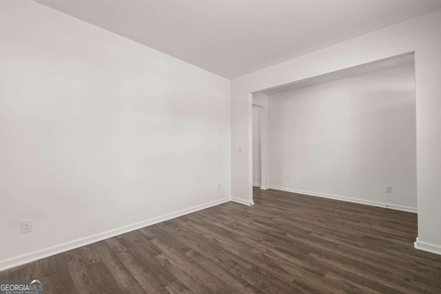 620 Lobelia Way, Locust Grove, GA 30248 - empty room with baseboards and dark wood-style flooring