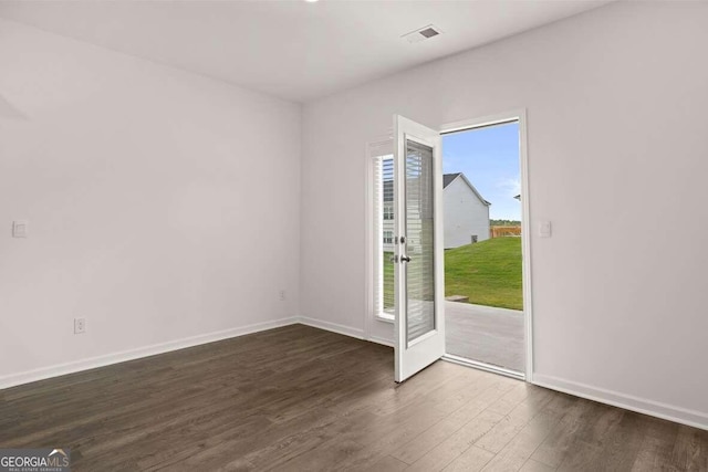 620 Lobelia Way, Locust Grove, GA 30248 - empty room with dark wood-type flooring and baseboards