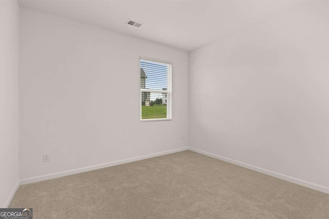 620 Lobelia Way, Locust Grove, GA 30248 - empty room with carpet