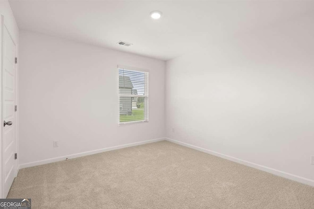 620 Lobelia Way, Locust Grove, GA 30248 - spare room with light carpet and recessed lighting