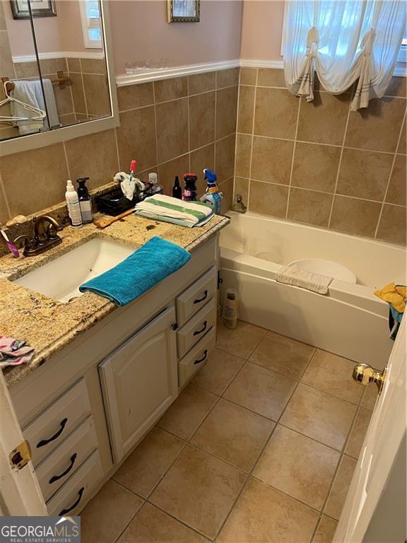 60 King Blvd, Mcdonough, GA 30253 - full bathroom with vanity, tile patterned floors, and tile walls