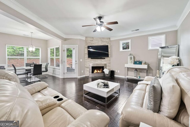 2939 Woodward Down Trl, Buford, GA 30519 - living area featuring a ceiling fan, crown molding, a stone fireplace, wood finished floors, and baseboards
