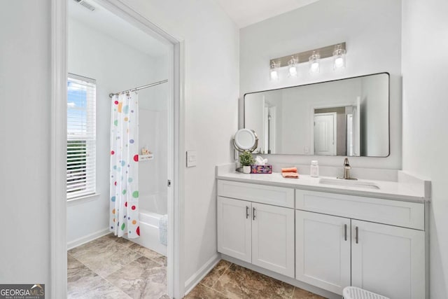 2939 Woodward Down Trl, Buford, GA 30519 - bathroom featuring vanity, shower / tub combo, and baseboards