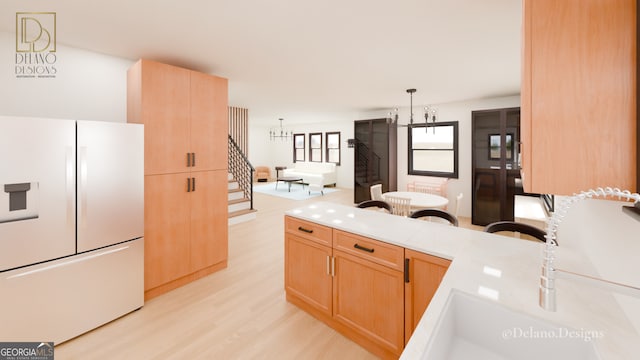 458 Shannon Dr SW, Atlanta, GA 30310 - kitchen featuring white fridge with ice dispenser, light wood finished floors, light countertops, light brown cabinetry, and a chandelier