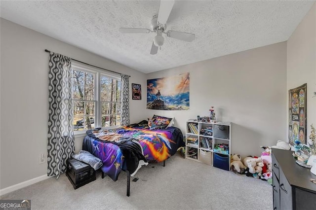 3271 Sutcliffe Rdg, Marietta, GA 30064 - carpeted bedroom with a textured ceiling, a ceiling fan, and baseboards