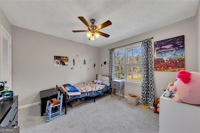 3271 Sutcliffe Rdg, Marietta, GA 30064 - carpeted bedroom with ceiling fan, baseboards, and a textured ceiling