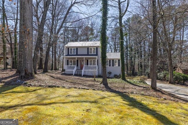 3271 Sutcliffe Rdg, Marietta, GA 30064 - view of front of home featuring covered porch and a front lawn