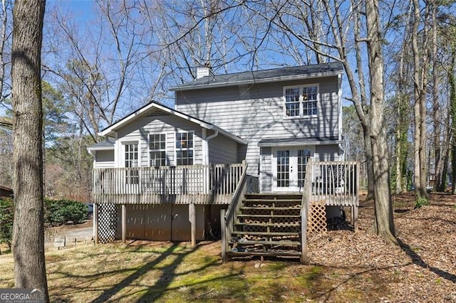 3271 Sutcliffe Rdg, Marietta, GA 30064 - rear view of house featuring a chimney, a deck, and stairs