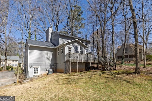 3271 Sutcliffe Rdg, Marietta, GA 30064 - back of house featuring stairs, central AC unit, a chimney, a deck, and a yard