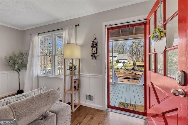 3271 Sutcliffe Rdg, Marietta, GA 30064 - doorway to outside with hardwood / wood-style floors, wainscoting, ornamental molding, and a decorative wall