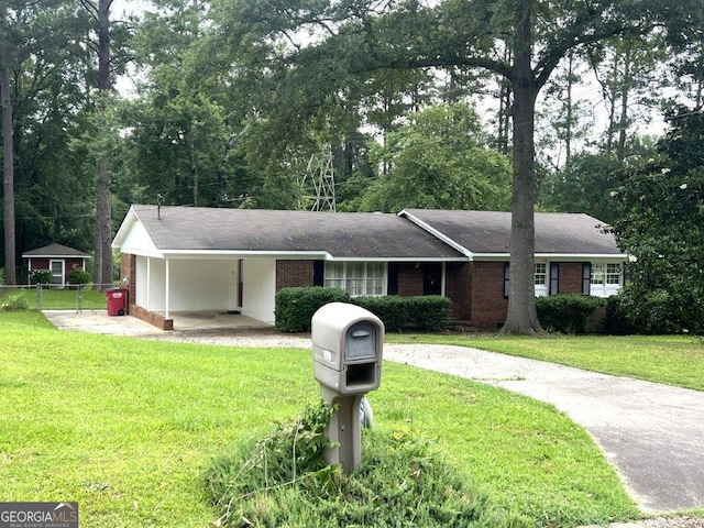 988 Hickory Ridge Dr, Macon, GA 31204 - ranch-style home featuring an attached carport, driveway, and brick siding