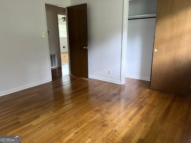 988 Hickory Ridge Dr, Macon, GA 31204 - unfurnished bedroom featuring wood finished floors, baseboards, and a closet