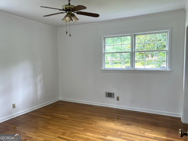 988 Hickory Ridge Dr, Macon, GA 31204 - empty room with crown molding, wood finished floors, baseboards, and a ceiling fan