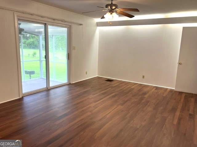 988 Hickory Ridge Dr, Macon, GA 31204 - empty room featuring plenty of natural light, a ceiling fan, and dark wood-type flooring
