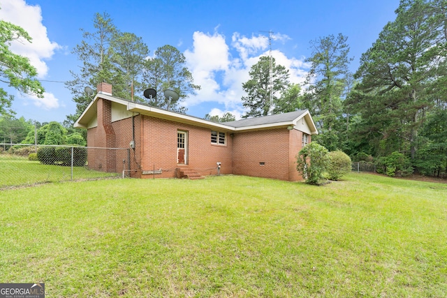 114 Pippin Rd, Hillsboro, GA 31038 - view of side of home featuring a chimney, brick siding, and entry steps