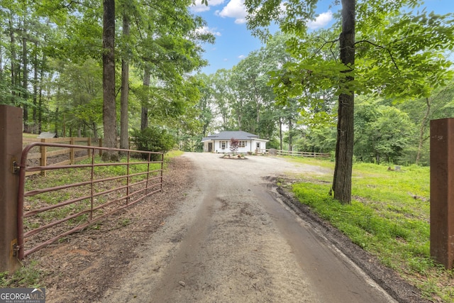 6290 Cascade Palmetto Hwy, Fairburn, GA 30213 - view of dirt / gravel road featuring a gate and a gated entry