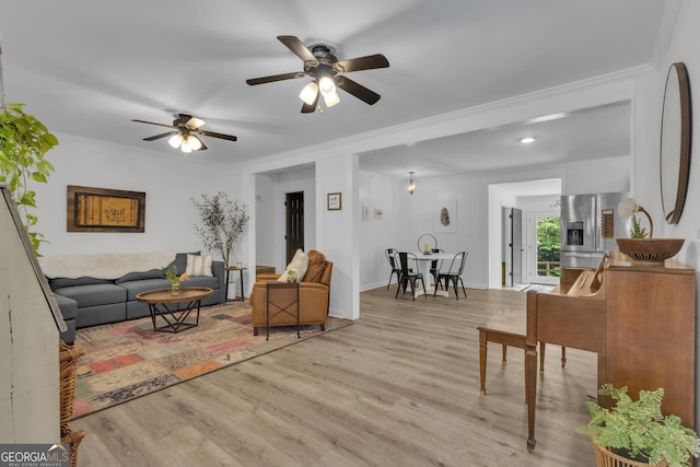 6290 Cascade Palmetto Hwy, Fairburn, GA 30213 - living area featuring crown molding, a ceiling fan, and wood finished floors