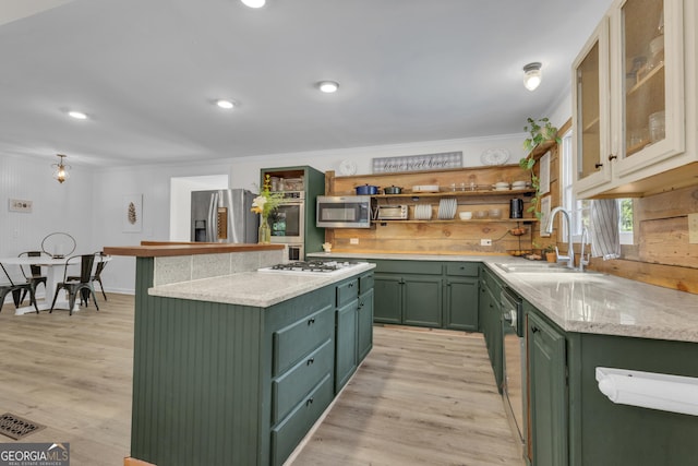 6290 Cascade Palmetto Hwy, Fairburn, GA 30213 - kitchen with green cabinets, appliances with stainless steel finishes, ornamental molding, open shelves, and a kitchen island