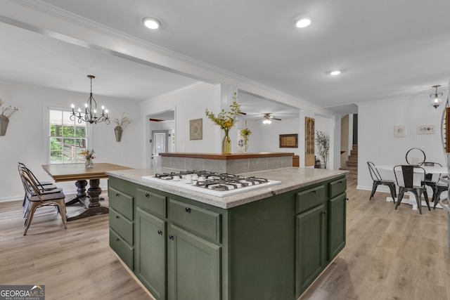 6290 Cascade Palmetto Hwy, Fairburn, GA 30213 - kitchen with green cabinetry, white gas stovetop, light wood-style flooring, and crown molding