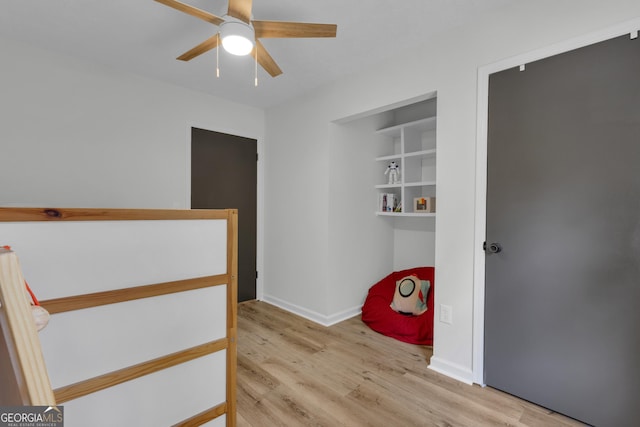 6290 Cascade Palmetto Hwy, Fairburn, GA 30213 - unfurnished bedroom with wood finished floors, a ceiling fan, and baseboards