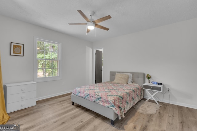 6290 Cascade Palmetto Hwy, Fairburn, GA 30213 - bedroom featuring wood finished floors, baseboards, and a ceiling fan