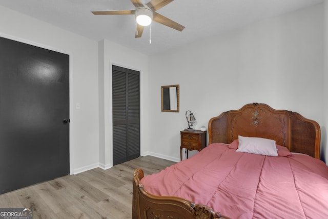 6290 Cascade Palmetto Hwy, Fairburn, GA 30213 - bedroom with wood finished floors, a closet, baseboards, and a ceiling fan