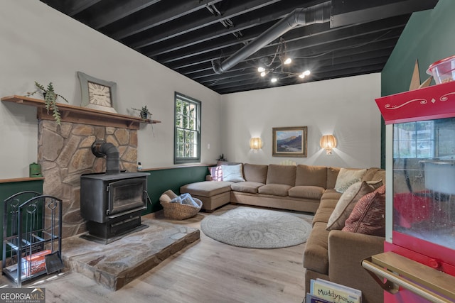 6290 Cascade Palmetto Hwy, Fairburn, GA 30213 - living room featuring a wood stove and wood finished floors