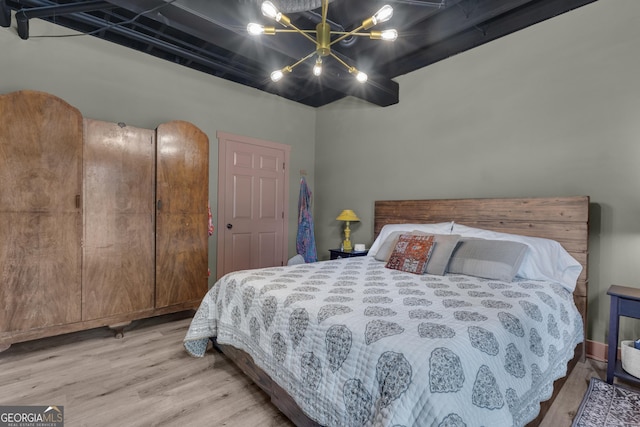 6290 Cascade Palmetto Hwy, Fairburn, GA 30213 - bedroom with a chandelier and wood finished floors