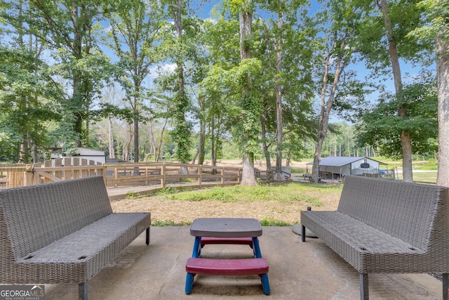 6290 Cascade Palmetto Hwy, Fairburn, GA 30213 - fenced backyard featuring a patio area and view of wooded area