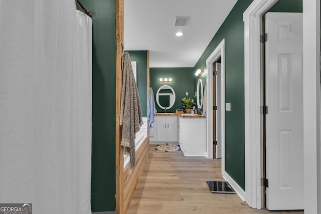 6290 Cascade Palmetto Hwy, Fairburn, GA 30213 - corridor featuring light wood-style flooring, recessed lighting, and a sink