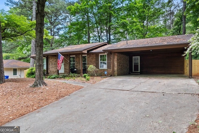 3431 Alcan Way, Tucker, GA 30084 - ranch-style home with concrete driveway, brick siding, and a carport