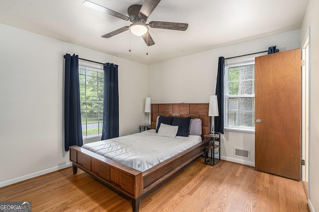 3431 Alcan Way, Tucker, GA 30084 - bedroom featuring light wood-style floors, baseboards, and multiple windows