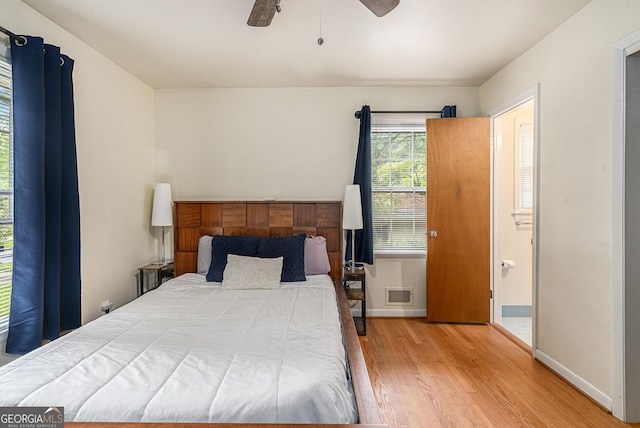 3431 Alcan Way, Tucker, GA 30084 - bedroom with wood finished floors, baseboards, a ceiling fan, and ensuite bathroom