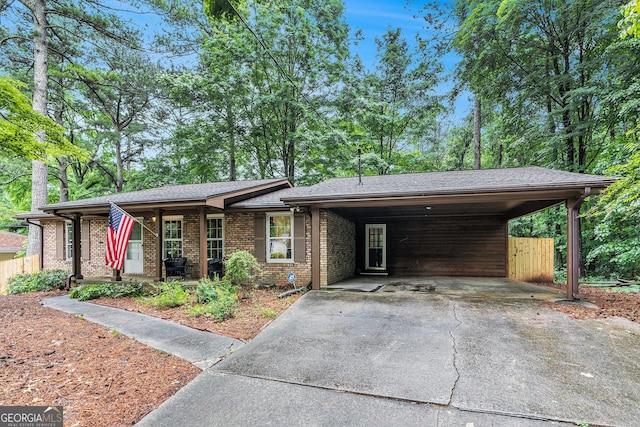 3431 Alcan Way, Tucker, GA 30084 - view of front of property with driveway, brick siding, a carport, and covered porch