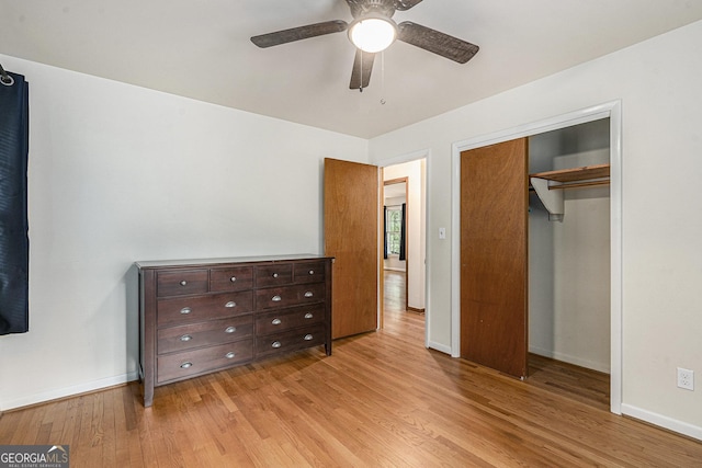 3431 Alcan Way, Tucker, GA 30084 - bedroom with light wood-style floors, baseboards, a closet, and a ceiling fan