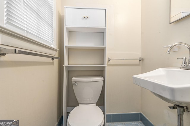 3431 Alcan Way, Tucker, GA 30084 - bathroom with toilet, baseboards, and a sink