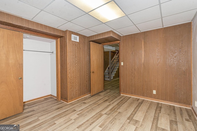 3431 Alcan Way, Tucker, GA 30084 - unfurnished bedroom featuring a paneled ceiling, wood walls, wood finished floors, and baseboards