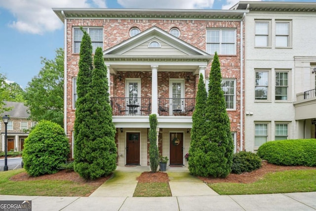 1858 Preserve Way, Atlanta, GA 30341 - view of front of property featuring a balcony, brick siding, and covered porch