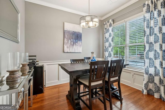 1858 Preserve Way, Atlanta, GA 30341 - dining space with a decorative wall, crown molding, wood finished floors, a chandelier, and wainscoting