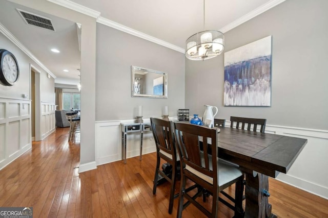 1858 Preserve Way, Atlanta, GA 30341 - dining area featuring crown molding, hardwood / wood-style flooring, a chandelier, and baseboards