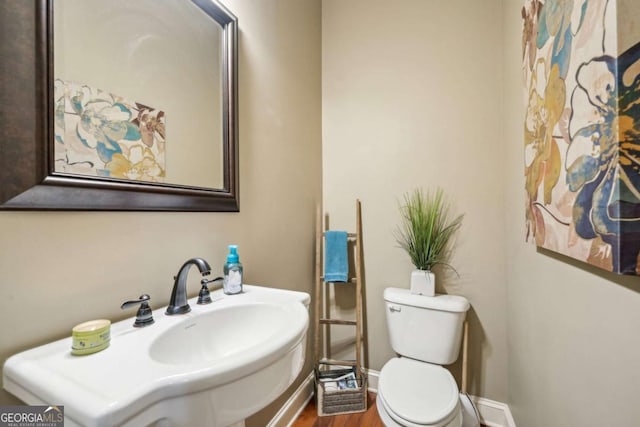 1858 Preserve Way, Atlanta, GA 30341 - bathroom featuring toilet, wood finished floors, baseboards, and a sink